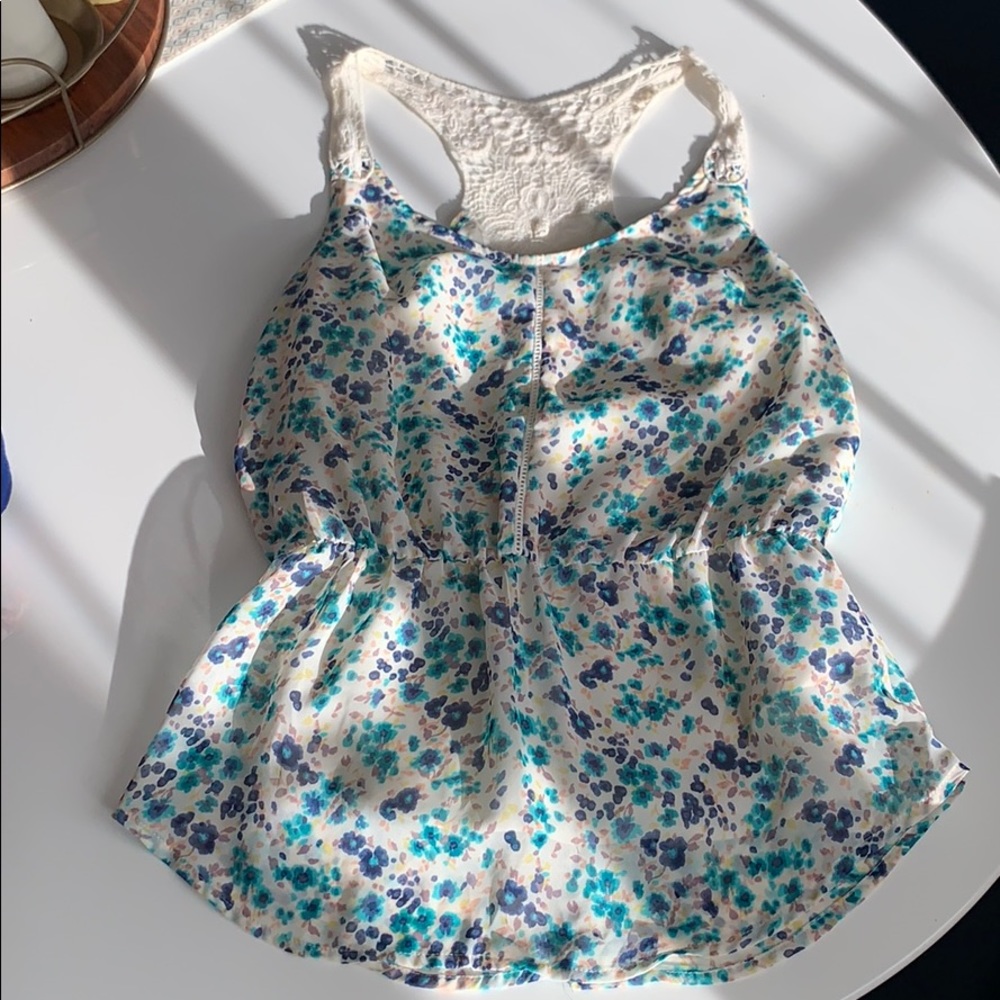 Floral tank with crochet accent on sleeve/back